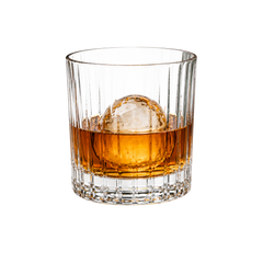 Premium whisky tumbler glass with whisky pour on a light background