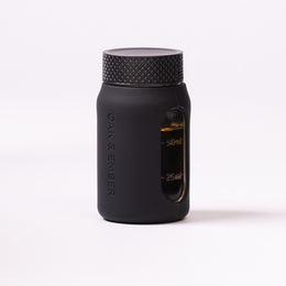 Flight Flask premium glass spirits flask with measurement window and protective silicone sleeve