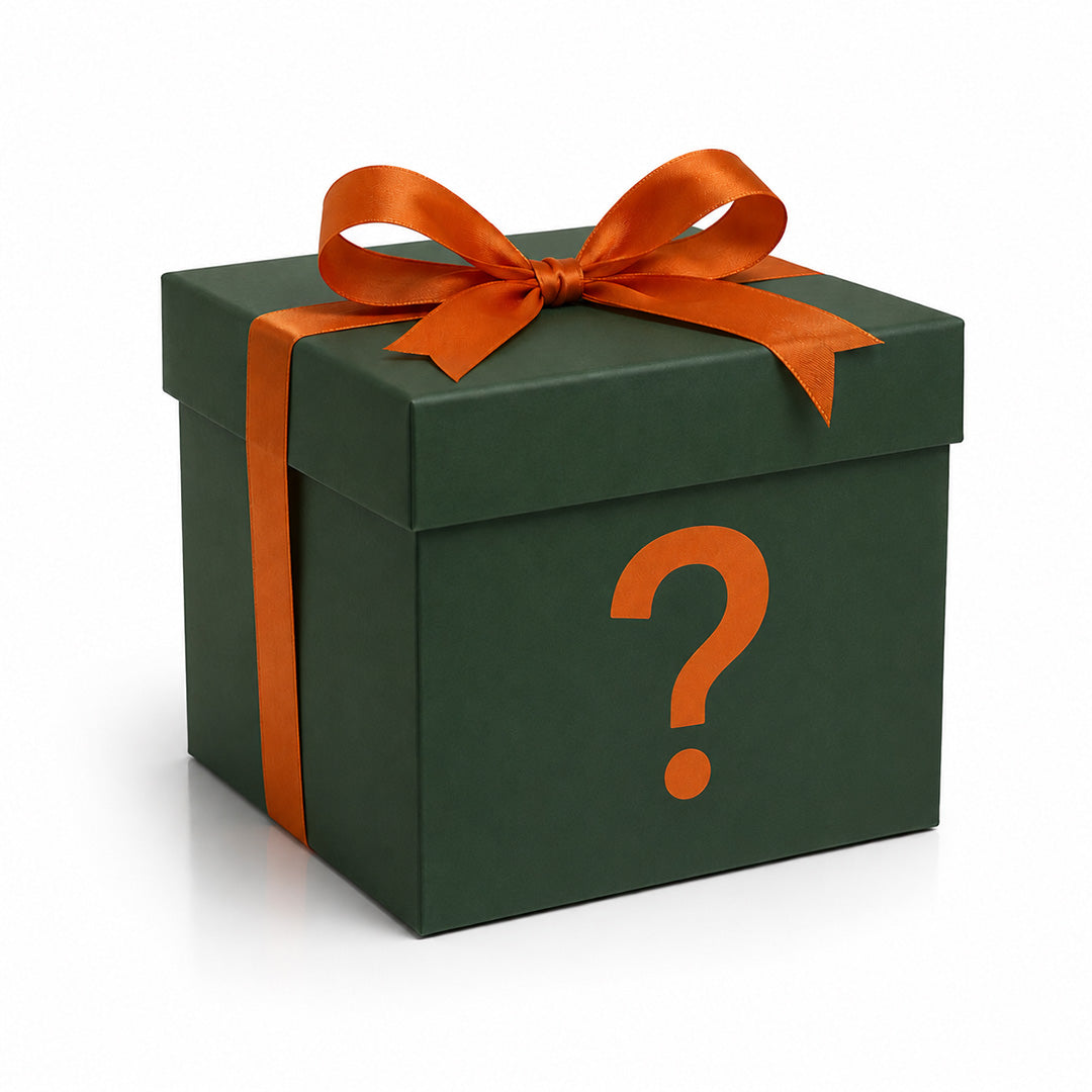 Green gift box with an orange question mark and ribbon on a white background
