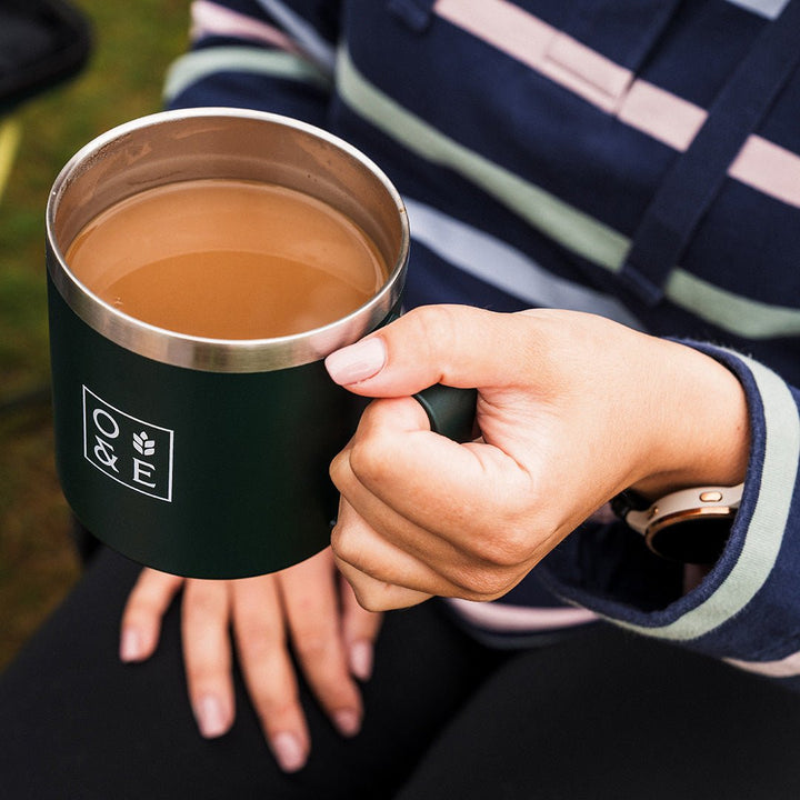 Oak & Ember 16oz insulated travel mug, lifestyle photo