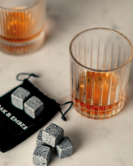 Whisky stones gift set with six granite chilling stones and black velvet storage pouch